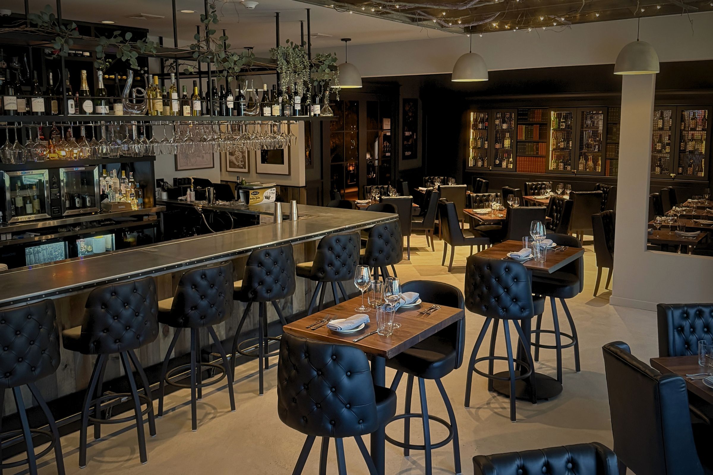 A musician performing in the warm light of Enology Wine Bar & Bistro