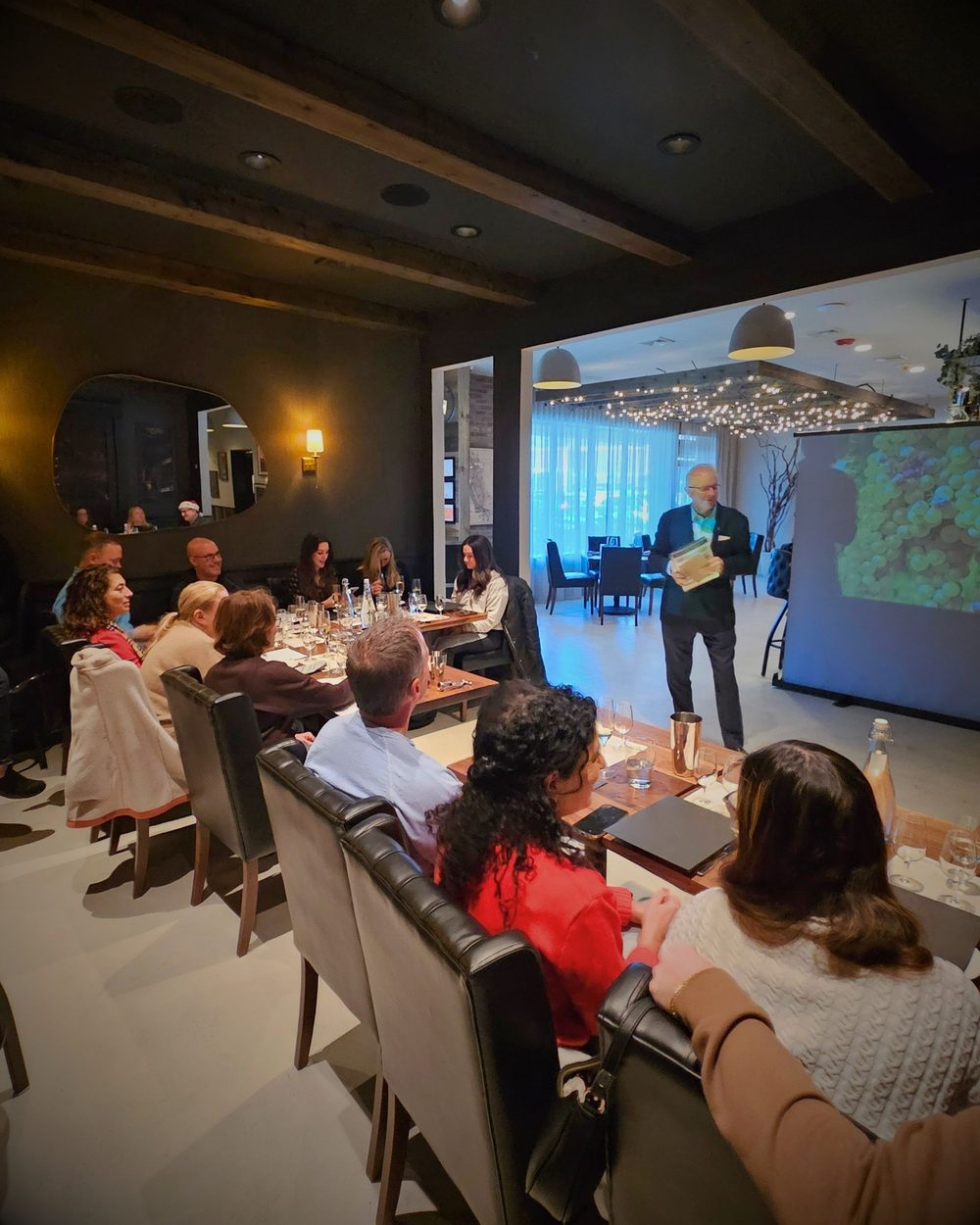 Guests gathered for a guided wine class at Enology Wine Bar and Bistro
