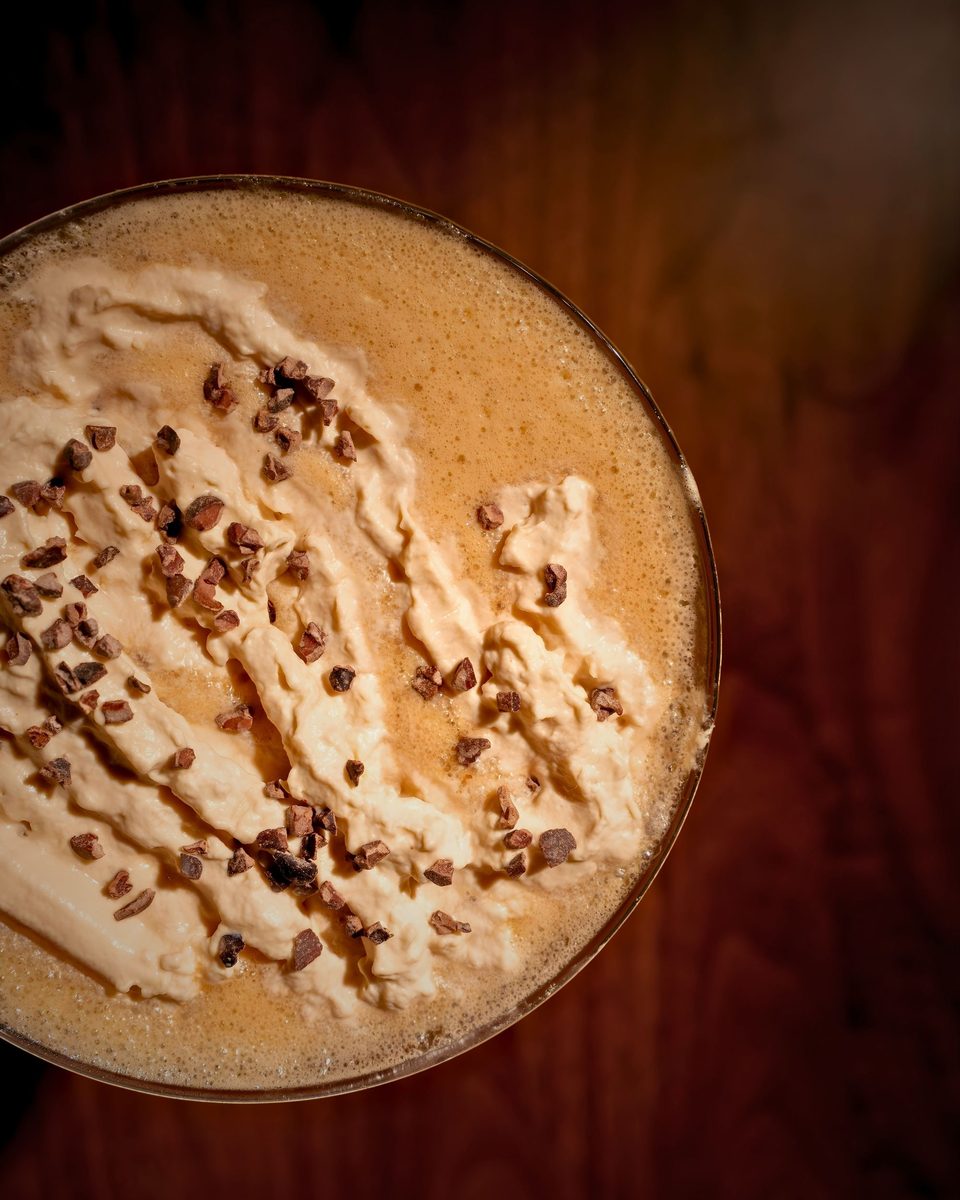 An espresso martini in detail at the bar at Enology Wine Bar & Bistro