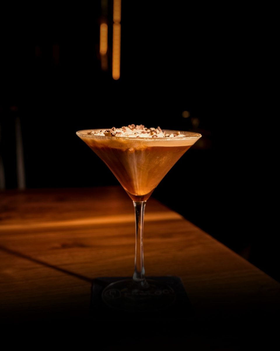 An espresso martini on the bar at Enology Wine Bar & Bistro in Saint James