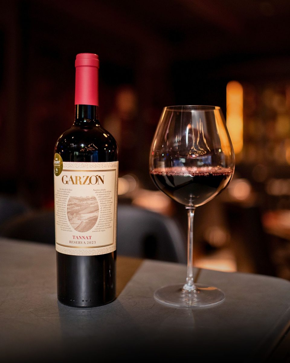 A bottle of Garzón Tannat and a poured glass at Enology Wine Bar & Bistro