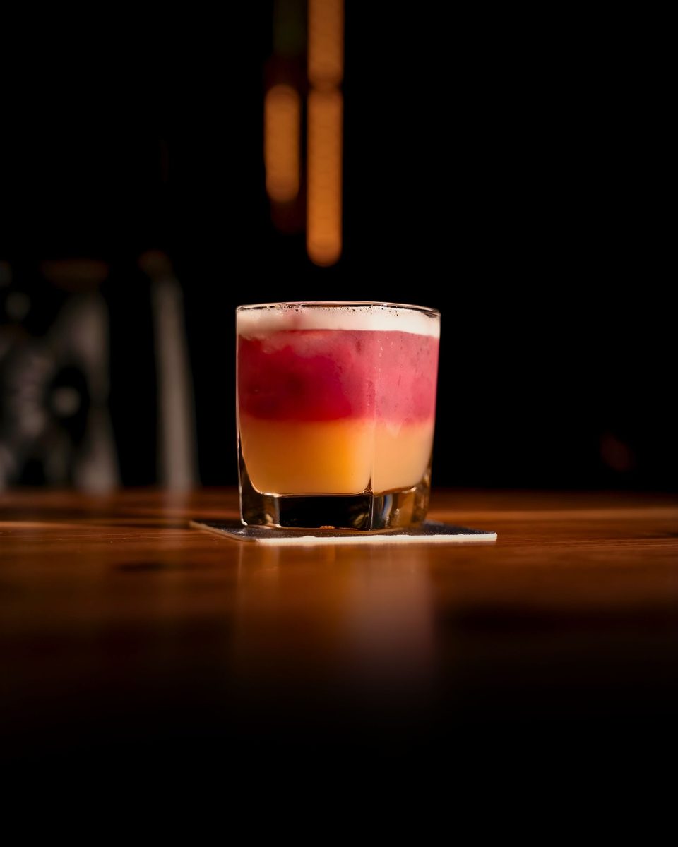 A summery sour cocktail at the bar at Enology Wine Bar & Bistro