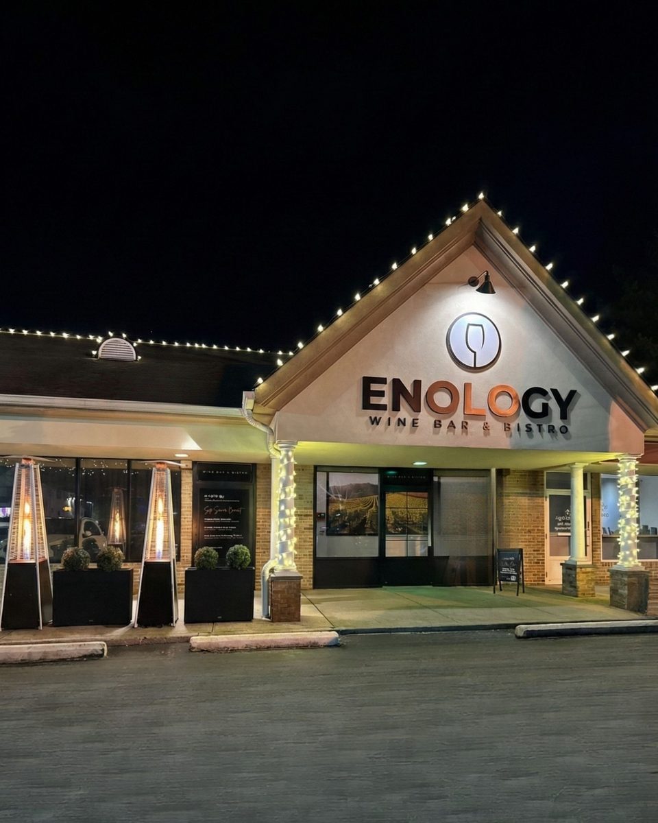 The storefront of Enology Wine Bar & Bistro on North Country Road in Saint James
